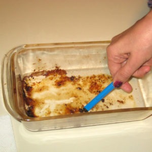 Scraping glass baking dish