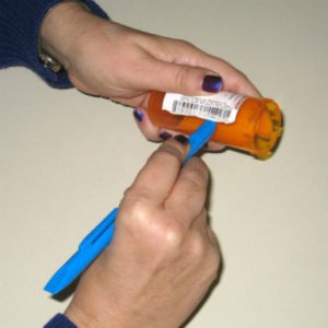 Scraping off prescription label