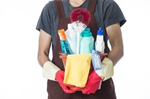 Person holding cleaning supplies