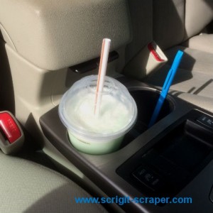 Scrigit Scraper in car cup holder 